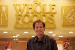John Mackey con  Whole Foods